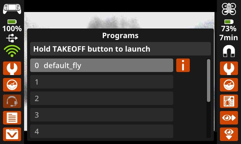 Una captura de pantalla de la pantalla del controlador con el menú Programas abierto. Dice "Mantenga presionado el botón de despegue para lanzar" y la ranura 0 en la parte superior dice "vuelo predeterminado".
