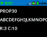 La pantalla del Cerebro muestra números y letras impresos con una fuente de tamaño PROP 30. Muestra de la A a la P. En la parte inferior de la pantalla, dice R:3 C:10.