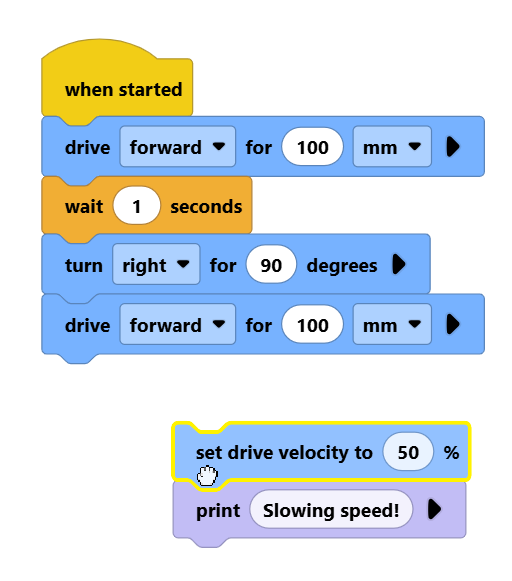 Screenshot of a set drive velocity block and its attached print block being dragged together as a group.