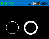 A screenshot of the IQ Brain screen with two white circles printed on the lower half of the screen. The circle on the left is drawn with a narrower border than the one the right.